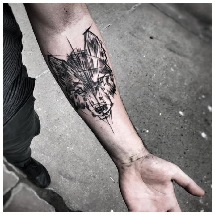 Wolf tattoo sa kamay ng isang tao