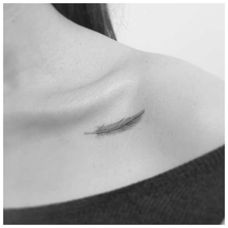 Minimalist na feather tattoo