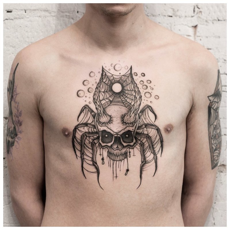 Isang tattoo ng spider sa estilo ng isang do-it-yourself na dibdib sa isang lalaki